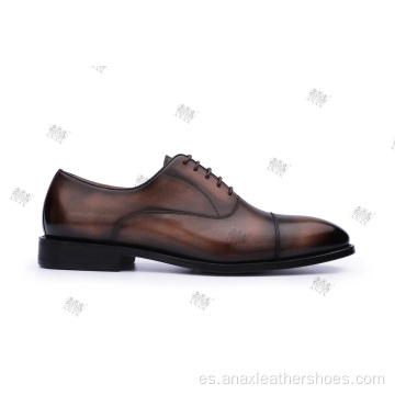 Zapatos casuales de piel con cordones y suela de goma